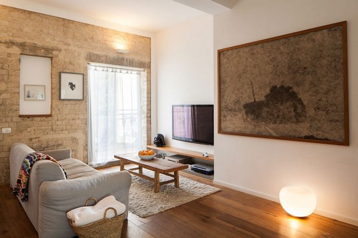 Small Grey Sofa and Brick Wall Decorations