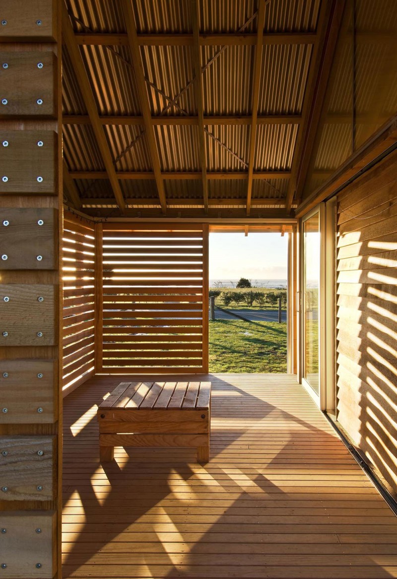 Wooden Shutters and Wooden Floor near the Glass Wall