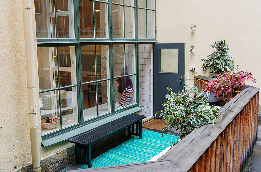 Black Bench and Blue Carpet near the Wide Glass Windows