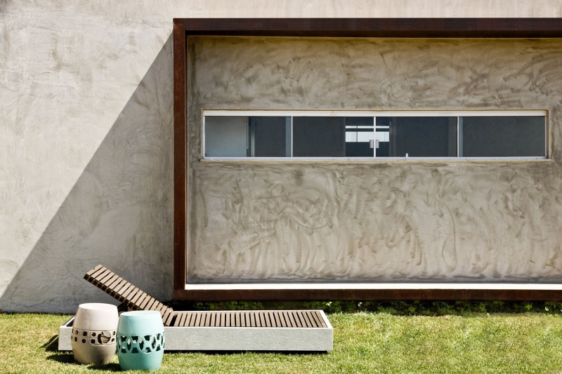Concrete Wall and Glass Windows near Grass Yard