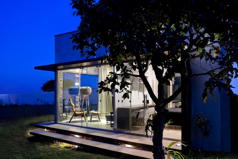 Exterior with the Bright Interior Lighting and Flat Roof