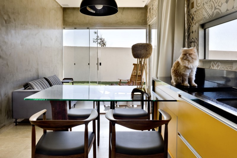Glass Table and Wooden Chairs under the Black Curve Lamp