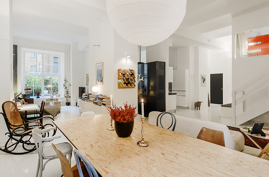 Minimalist Chairs under White Rounded Lamp