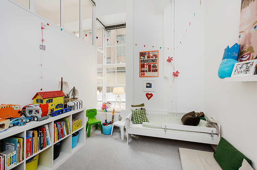 Shelves in Kids Bedroom with White Bed and Grey Floor