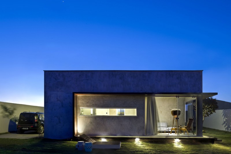 Wide Glass Walls and Concrete Wall under the Flat Roof