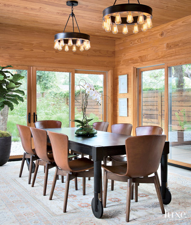 Brown Dining Room with Industrial Light Fixture and Sliding Doors