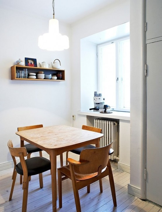 Scandinavian Dining Room Design with Modern Light Fixture