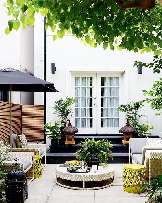 Contemporary patio with modern white wicker sofa and chairs Contemporary patio with modern white wicker sofa and chairs
