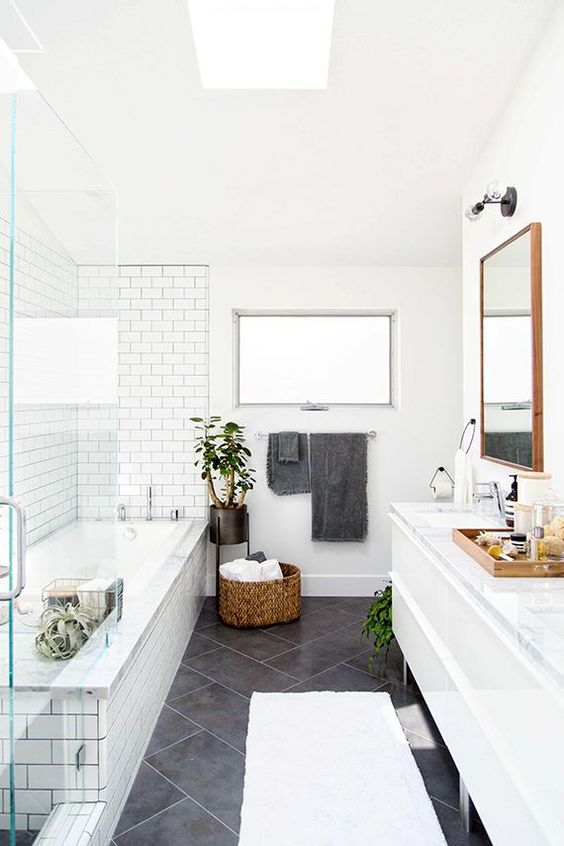 Subway Tile Bathroom Types Large charcoal gray diagonal tiles on the floor paired with the white subway tiles