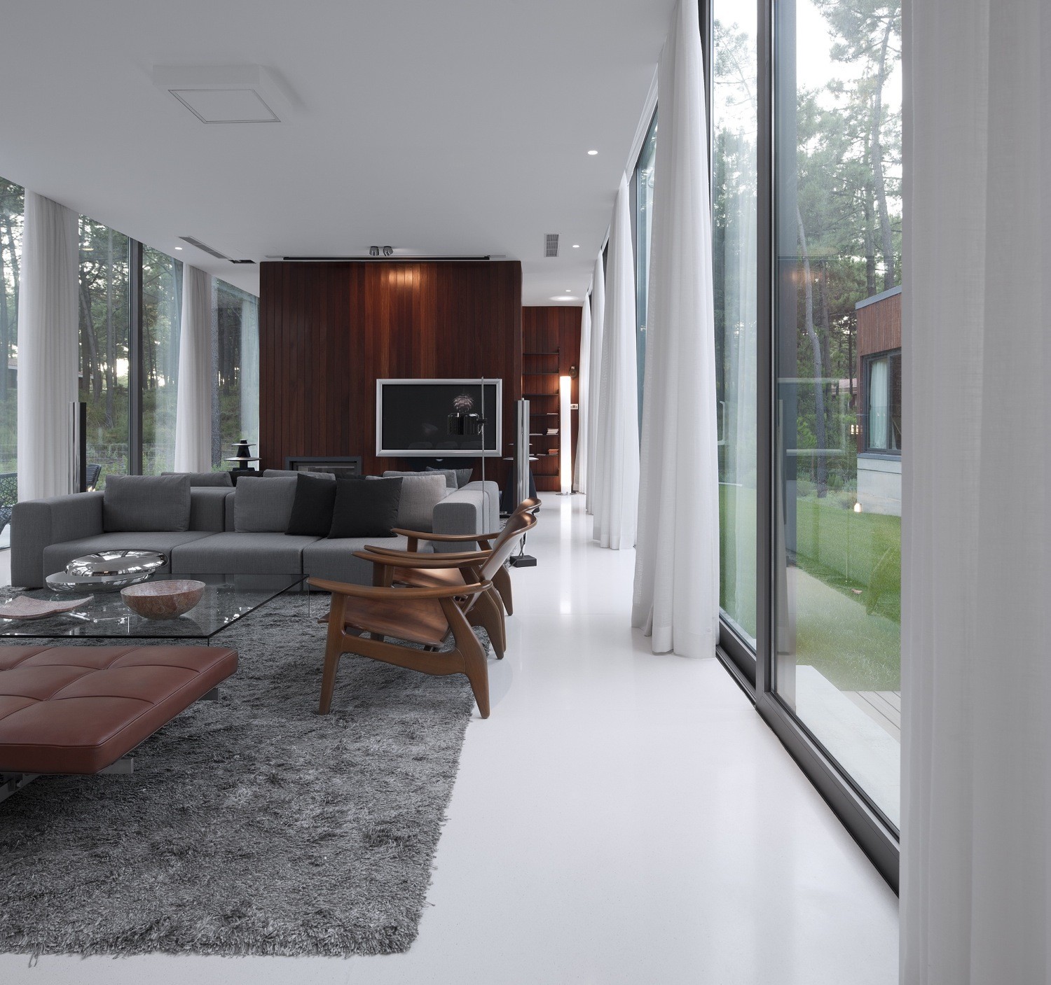 Brown Leather Sleeper Sofa At Living Room Among Square Glass Top Coffee Table Near Grey Carpet At Aroeira III House Brown Leather Sleeper Sofa At Living Room Among Square Glass Top Coffee Table Near Grey Carpet At Aroeira III House