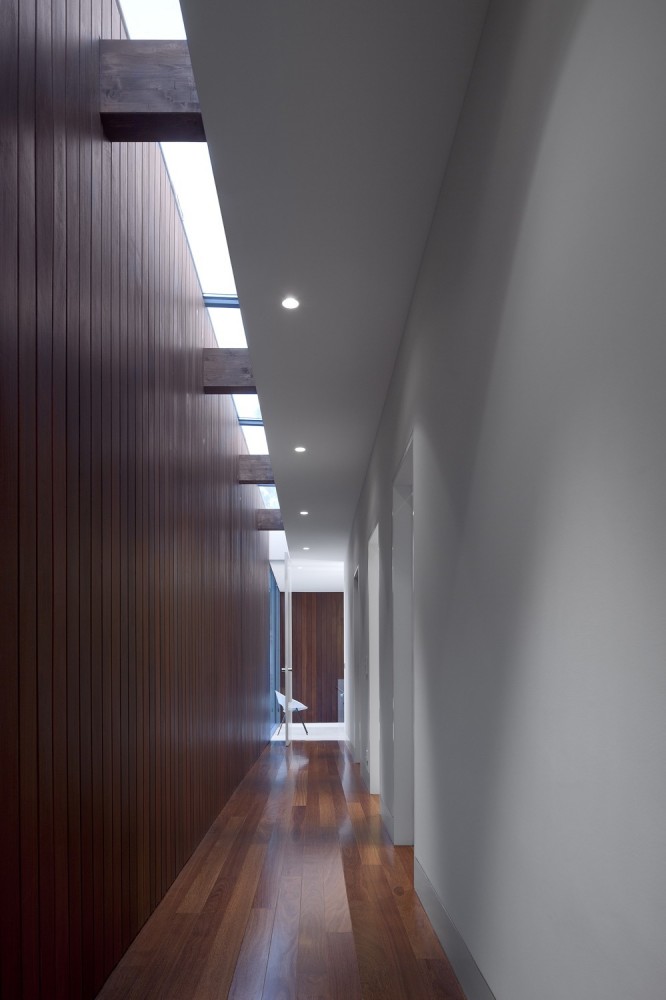 Hallway At Aroeira III House Among Grey Also Pallet Wall With Wood Floor Lit Up By Long Skylight And Ceiling Lamps Hallway At Aroeira III House Among Grey Also Pallet Wall With Wood Floor Lit Up By Long Skylight And Ceiling Lamps