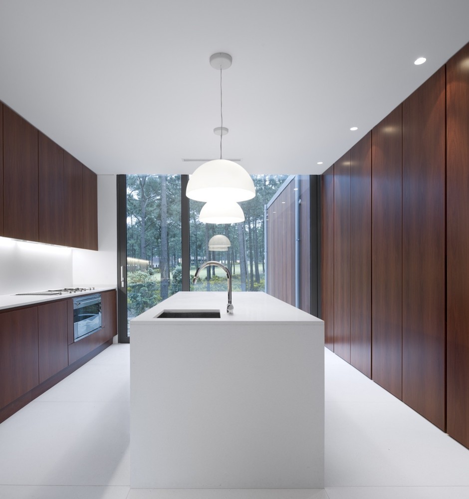 Kitchen Design At Aroeira III House Among Darkwood Cabinetry Also White Backsplash Lit Up By Hidden Lamp Kitchen Design At Aroeira III House Among Darkwood Cabinetry Also White Backsplash Lit Up By Hidden Lamp