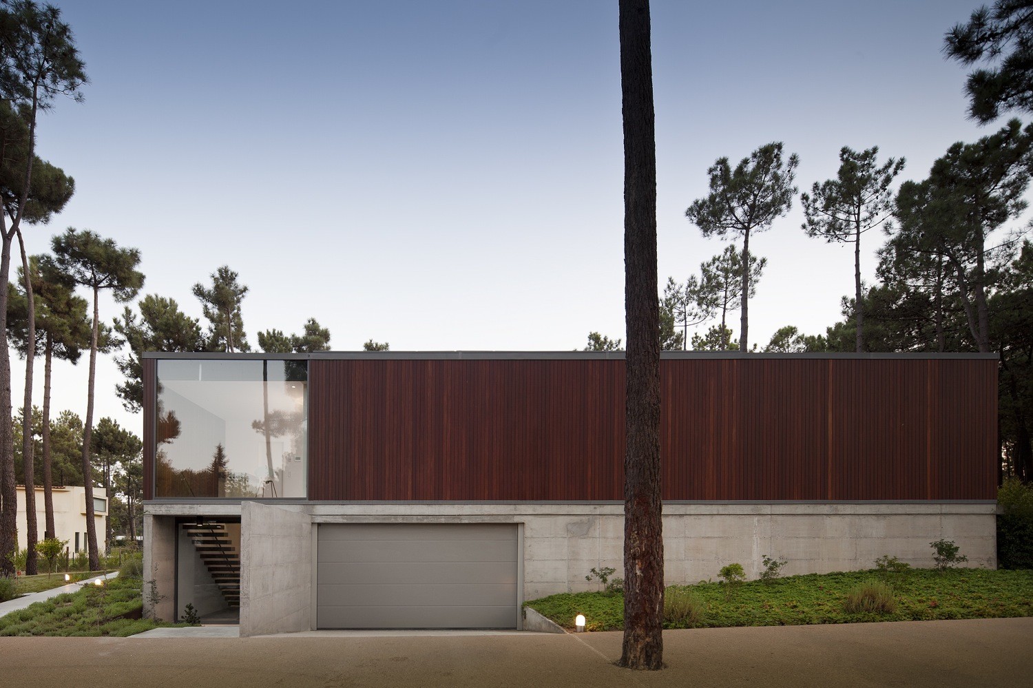 Two Storey House Outside View Among Glass Entry Door Also Grey Garage Door On The Bottom from Main Room from Aroeira III House Two Storey House Outside View Among Glass Entry Door Also Grey Garage Door On The Bottom from Main Room from Aroeira III House