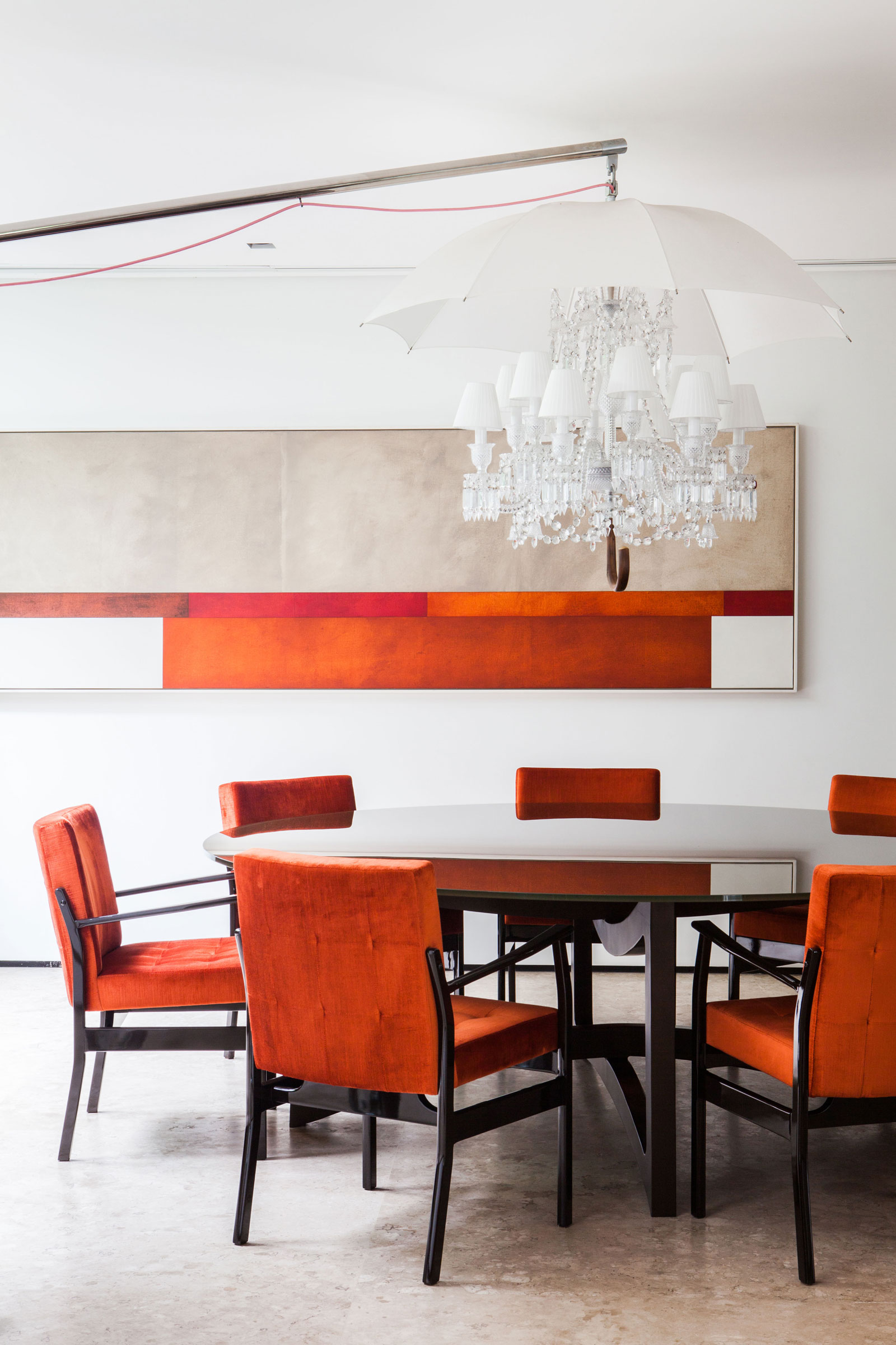 Round Table Combined Among Orange Armchairs Completed With Rectangular Mirror