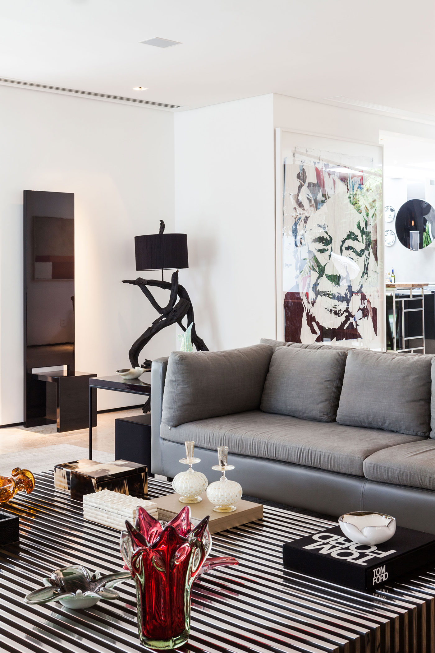 Sofa Among Black Side Table Completed With Stainless Steel Coffee Table