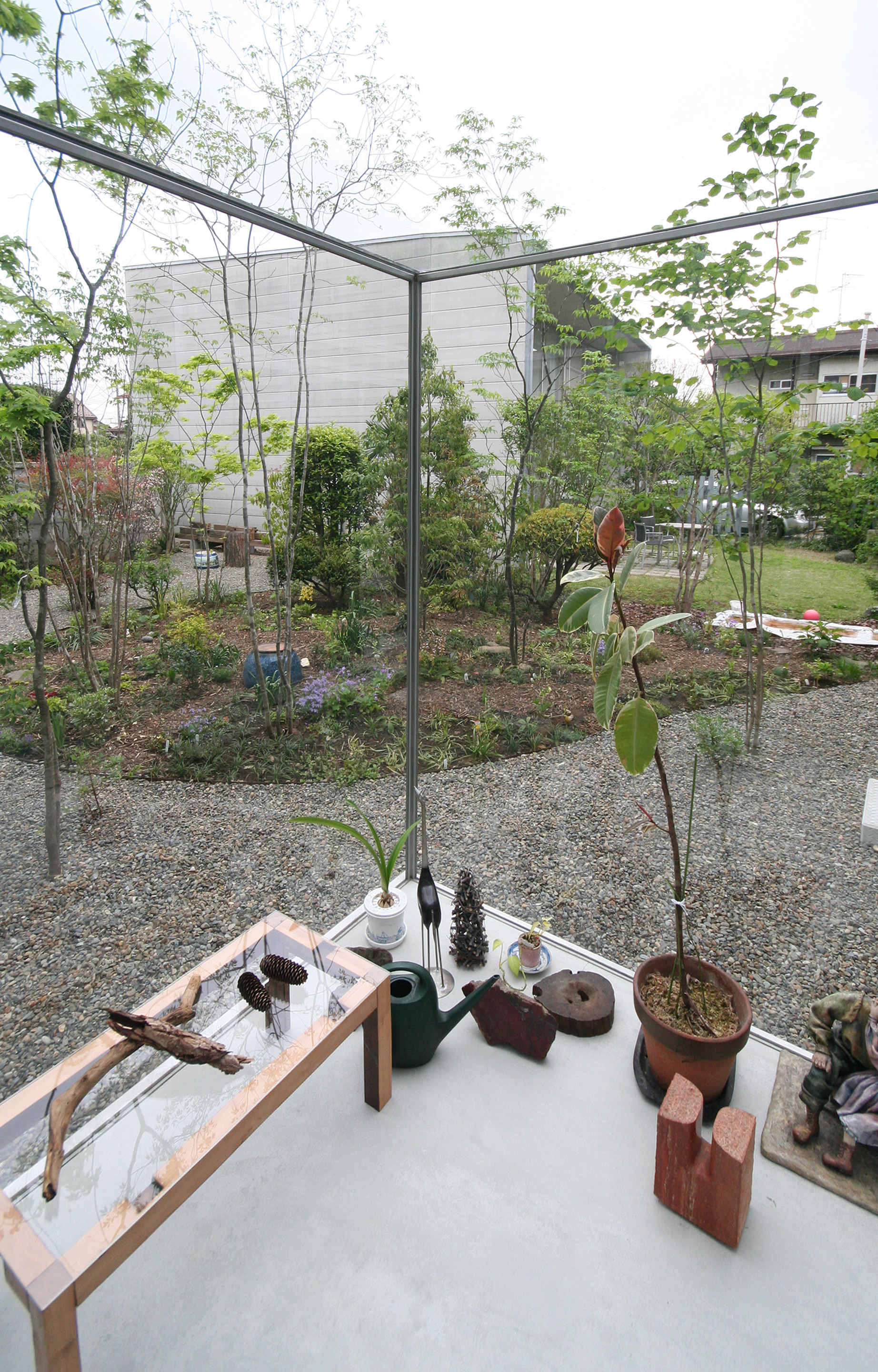 Interesting Garden House Exterior Involving Gravels Garden Along Near Concrete Flooring To Cover Gardening Spot Near Frame Interesting Garden House Exterior Involving Gravels Garden Along Near Concrete Flooring To Cover Gardening Spot Near Frame