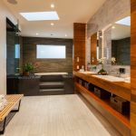 Bathroom Decoration with Wide Mirror On Wall Added Near Vase Of Flower On Table