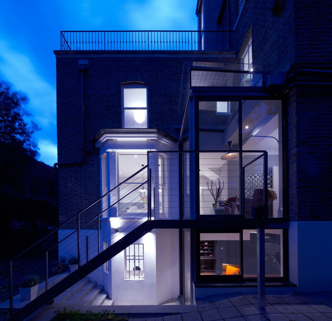 Bright Lightings Over Wide Glass Bay Windows On Frontside Wall Decoration Bright Lightings Over Wide Glass Bay Windows On Frontside Wall Decoration