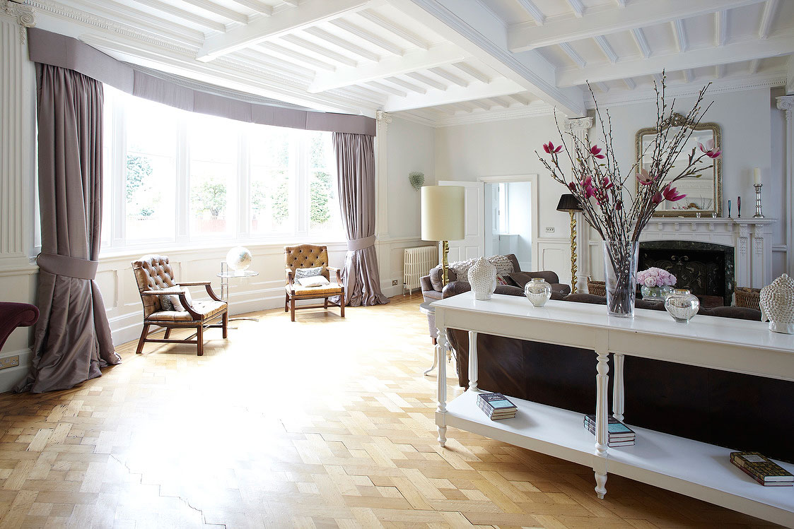 Including Arched Round Windows On Wall Added Near Twin Brown Armchairs Also Drum Floor Lamps