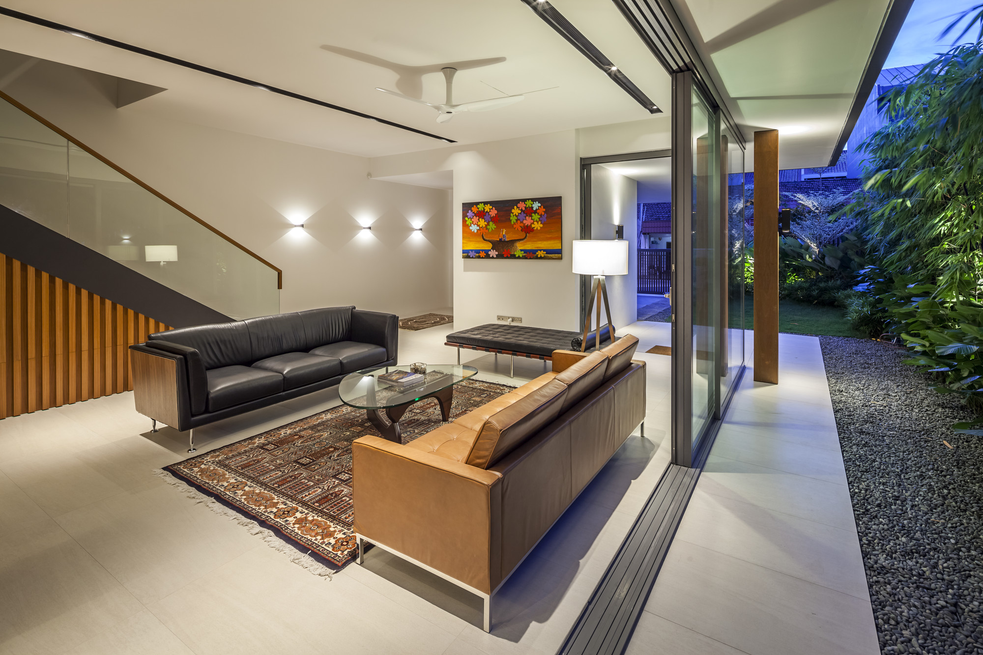 Living Area with Dark Colored Comfy Sofa Along With Bright Clear Lighting From Wall Lamp Living Area with Dark Colored Comfy Sofa Along With Bright Clear Lighting From Wall Lamp