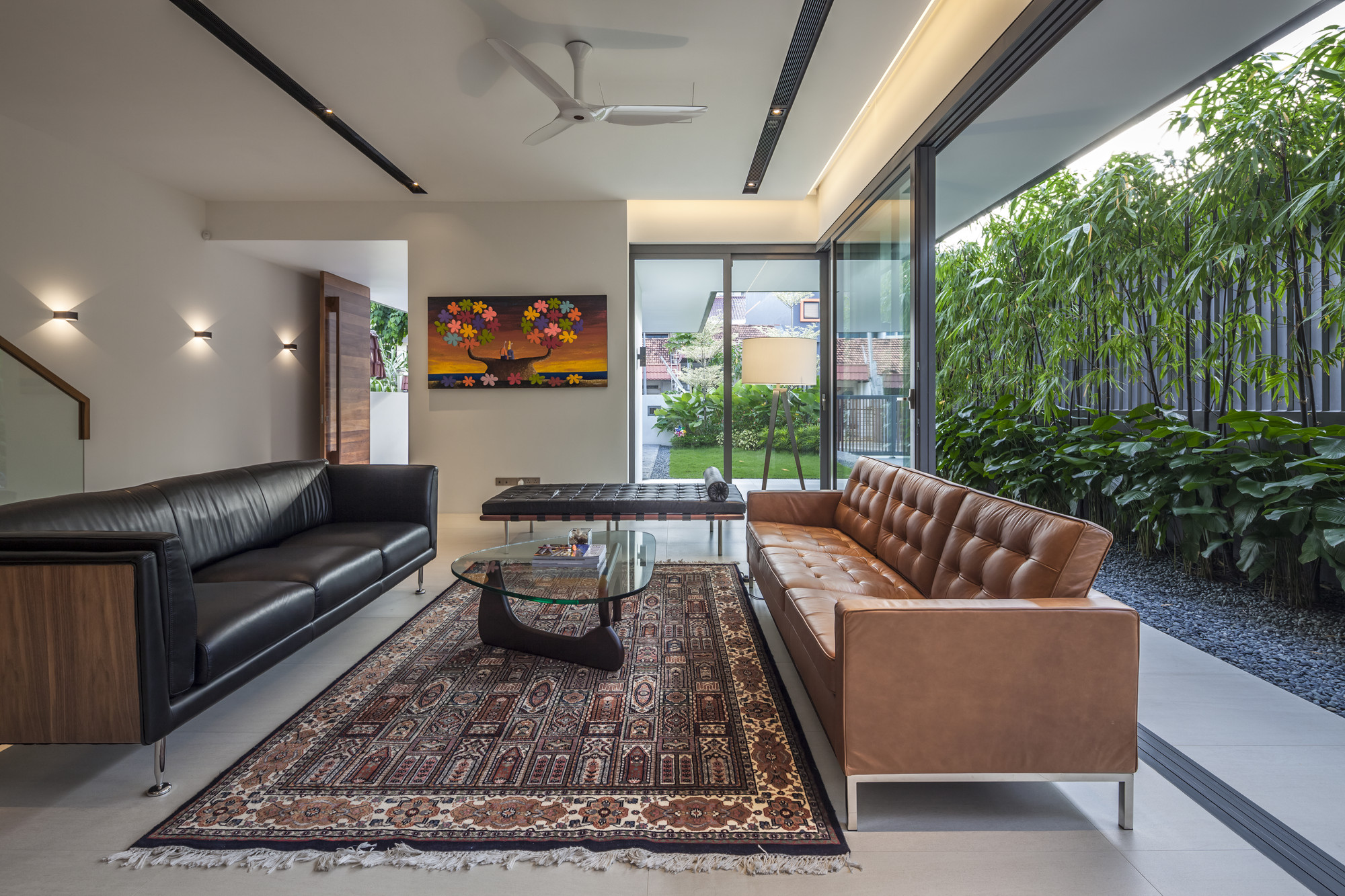 Living Room with Dark Brown Colored Rug Carpet Along With Triangular Glass Table Surface Living Room with Dark Brown Colored Rug Carpet Along With Triangular Glass Table Surface