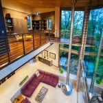 Living Room with Purple Sofa and Glass Table as Decoration