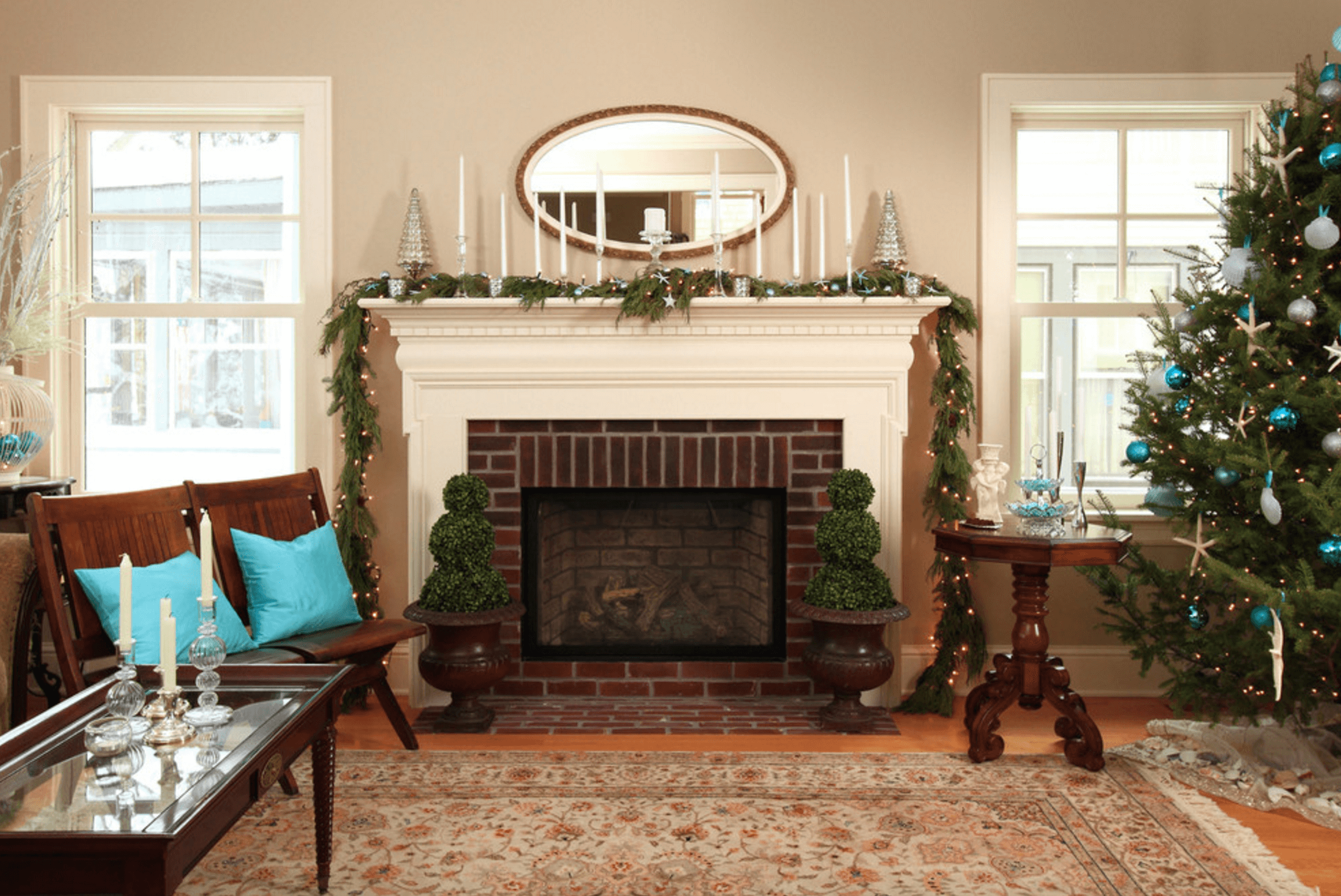 Small Fireplace Wall Added Near An Oval Mirror On Grey Wall Background Also Christmas Tree On Floor