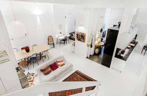 Fascinating White Apartment Design Spacious For Living Room Near Colorful Couches On Clear Sofa Added With Brown Rug On Floor