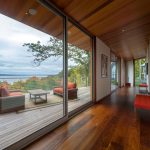 Twin Loungers Added Near Square Table On Wooden Floor