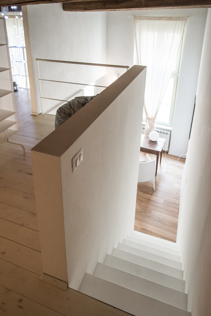 Via delle Orfane by CON3STUDIO - Indoor Stair Land On Woodn Board Flooring Added Near Wooden Table Via delle Orfane by CON3STUDIO - Indoor Stair Land On Woodn Board Flooring Added Near Wooden Table