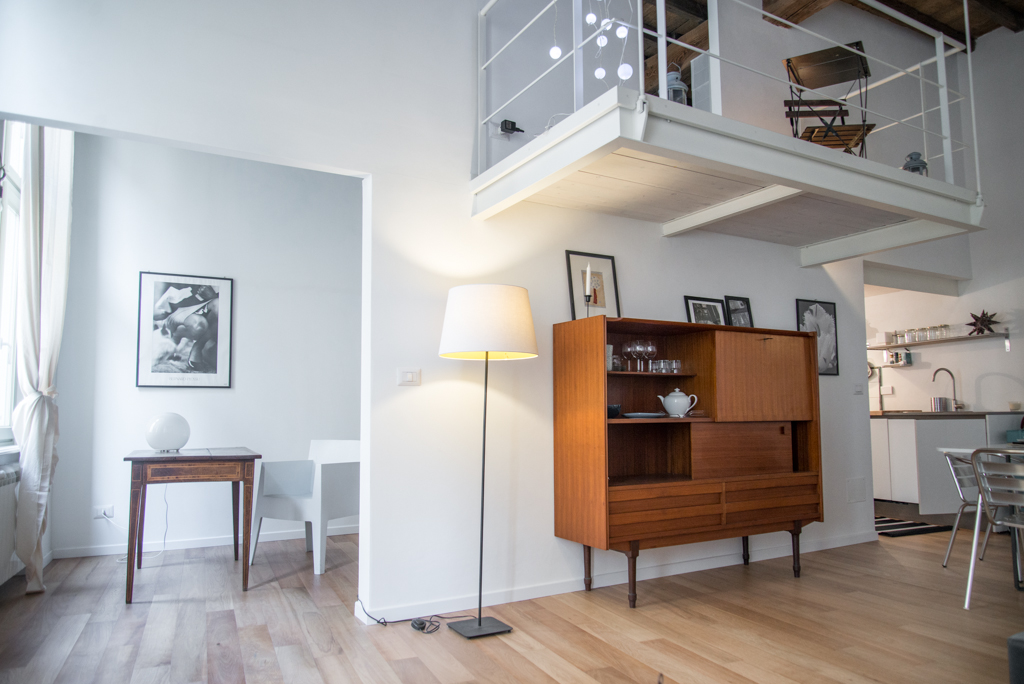 Via delle Orfane by CON3STUDIO - Wooden Cupboard Added Near Floor Lamps On Wooden Board Flooring Decor Via delle Orfane by CON3STUDIO - Wooden Cupboard Added Near Floor Lamps On Wooden Board Flooring Decor