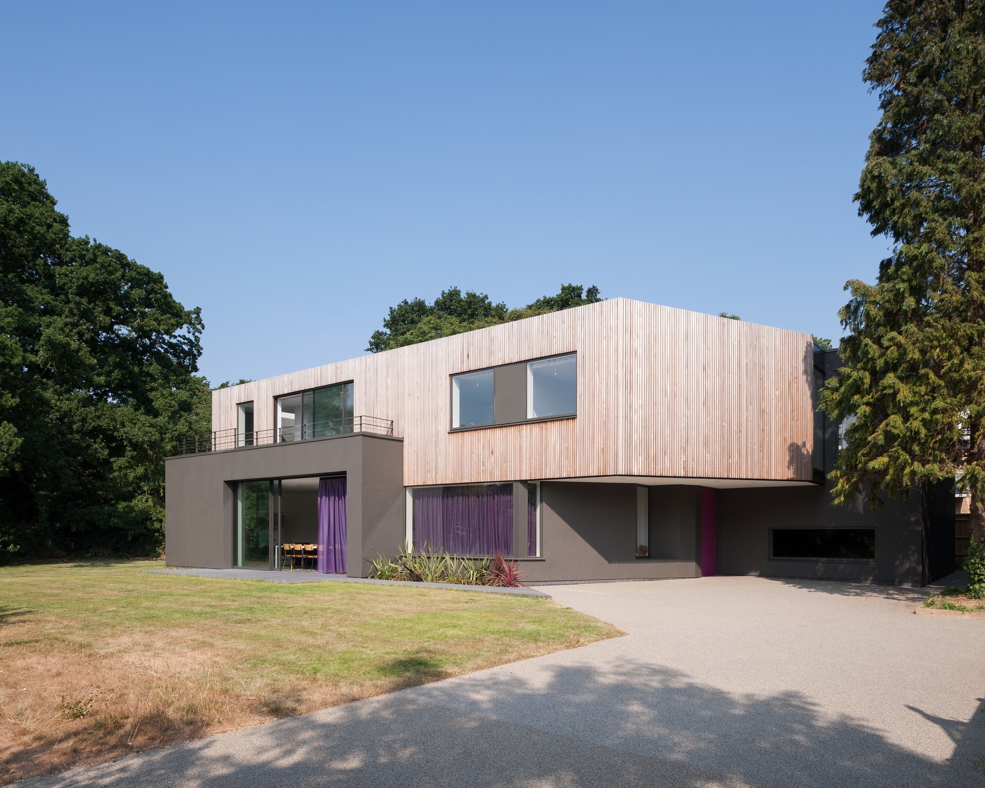 Wedge House by SOUP Architects With Comfy Brown Colored Upper Wall Which Is Made From Wooden Veneer Along With Dark Colored Low Outer Wall Wedge House by SOUP Architects With Comfy Brown Colored Upper Wall Which Is Made From Wooden Veneer Along With Dark Colored Low Outer Wall
