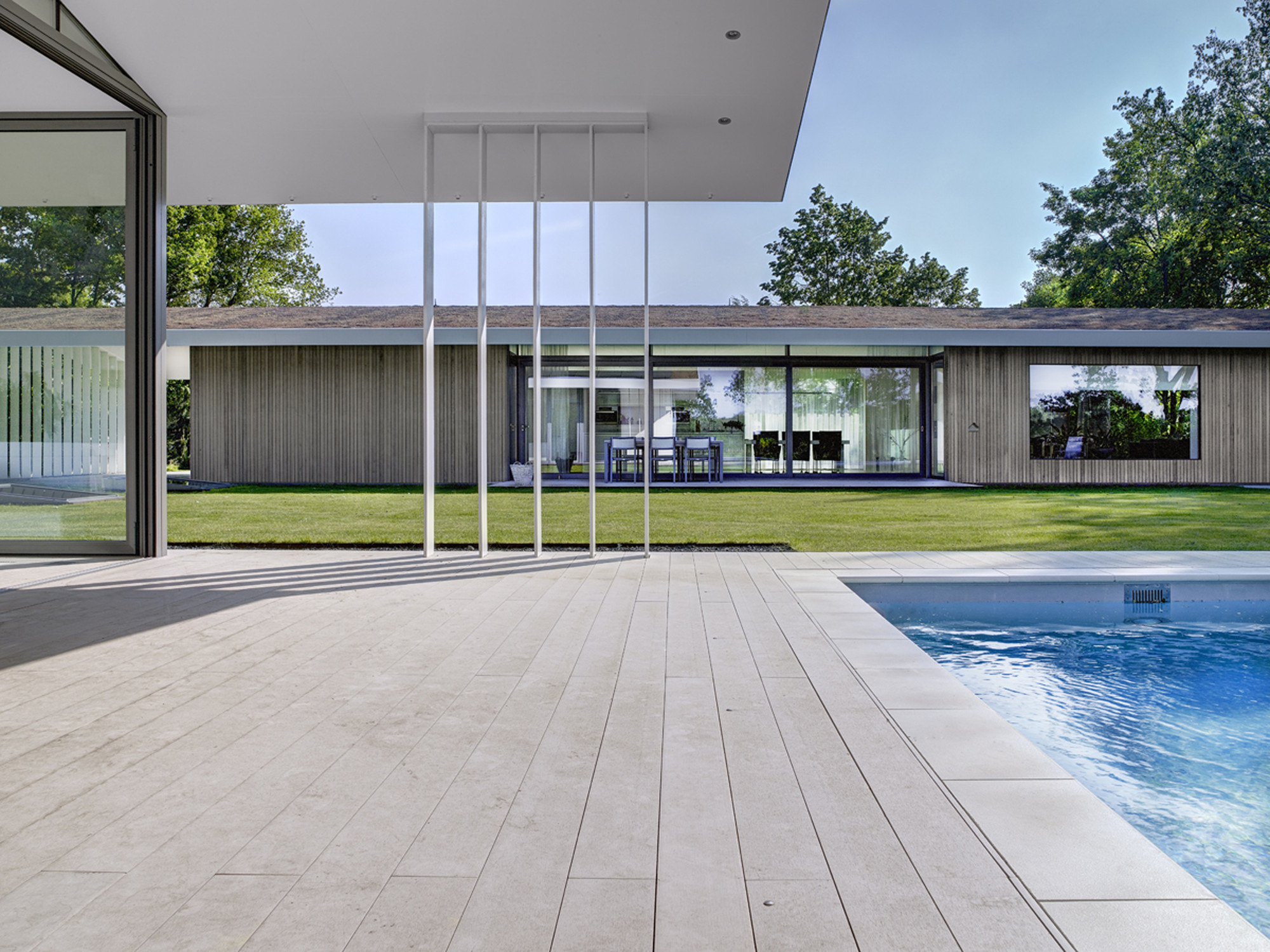 Swimming Pool with White Colored Floor Which Is Made From Wooden Veneer Swimming Pool with White Colored Floor Which Is Made From Wooden Veneer