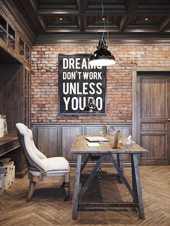 Beautiful wood work and brick wall in this masculine home office