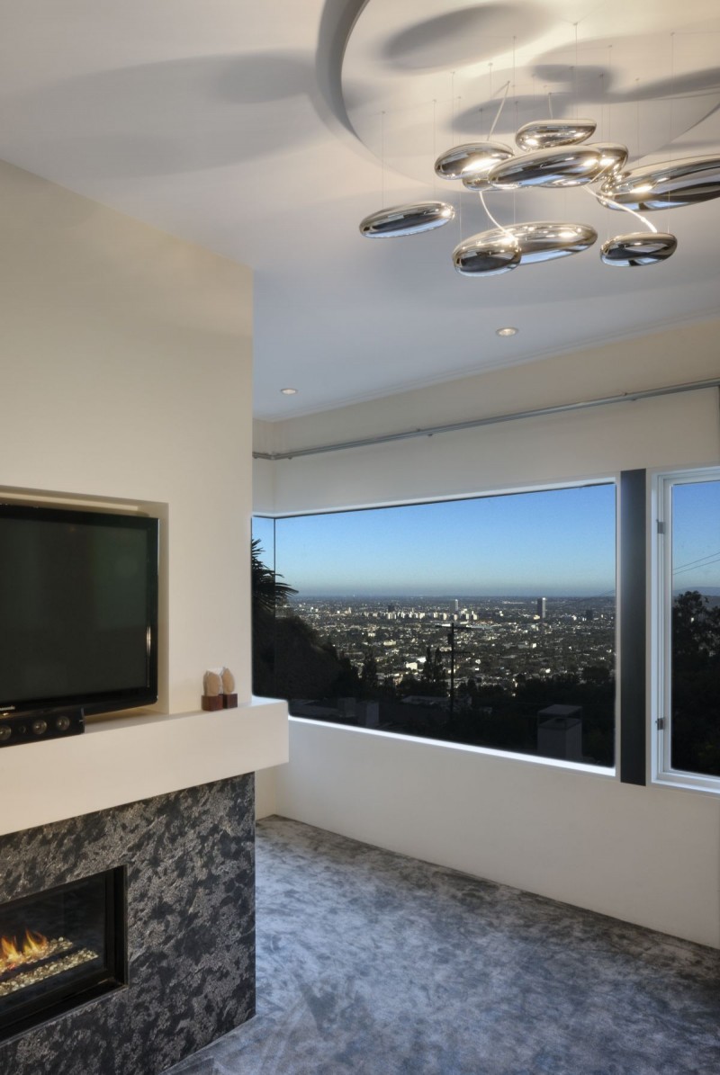 Fascinating Fireplace Design Near Mounted Wall TV Along With Contemporary Chandelier Fascinating Fireplace Design At West Hollywood Residence Family Room Near Mounted Wall TV Along With Contemporary Chandelier