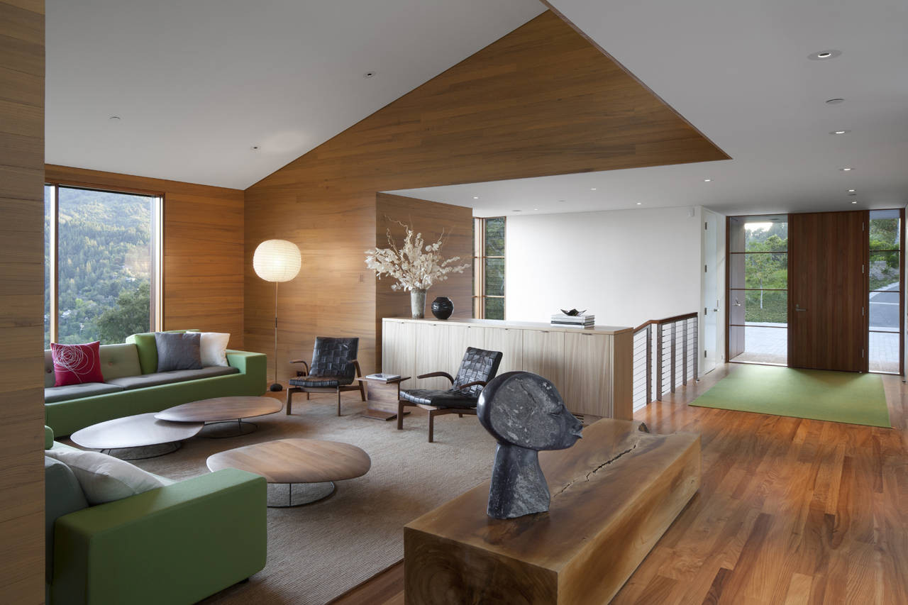 Marvelous Living Room At Kentfield House Near Green Sectional Sofa Along With Exclusive Round Coffee Table On Grey Carpet Marvelous Living Room At Kentfield House Near Green Sectional Sofa Along With Exclusive Round Coffee Table On Grey Carpet