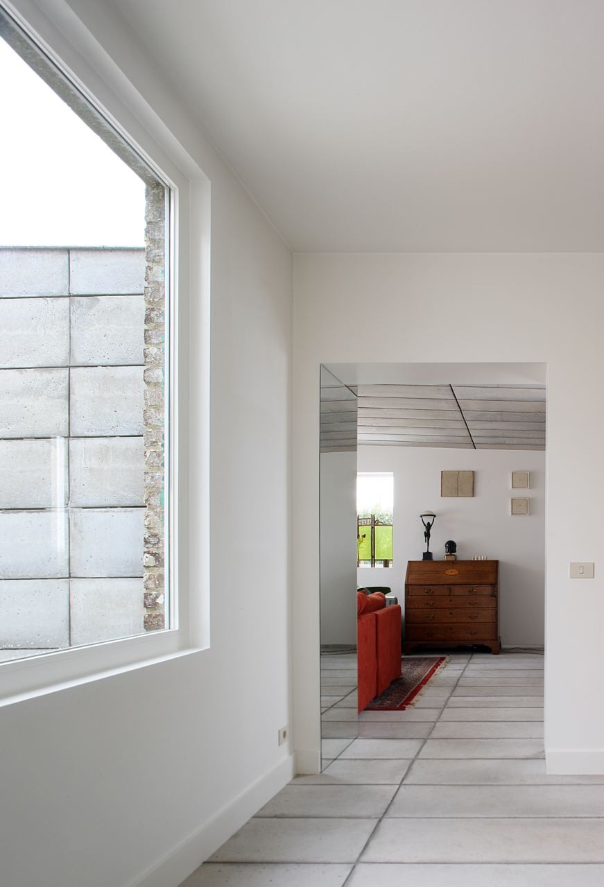 House H by Architecten de Vylder Vinck Taillieu - Displaying Comfy Red Living Room Near Wooden Dresser For Decoration House H by Architecten de Vylder Vinck Taillieu - Displaying Comfy Red Living Room Near Wooden Dresser For Decoration