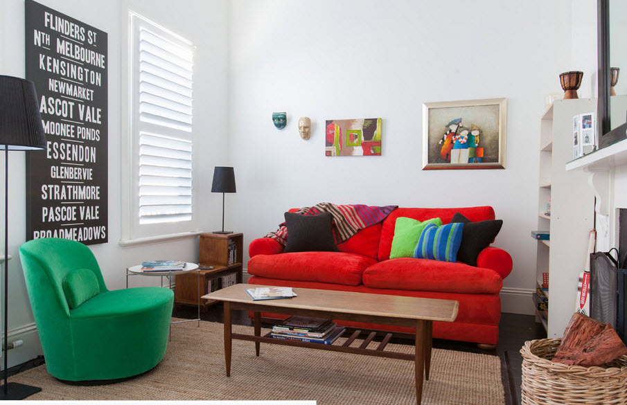 Living room with red sofa and green chair