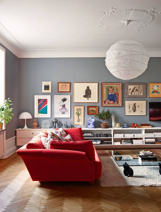 Modern living room design with red sofa