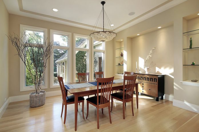 Floor Trim as Interior Decoration for Dining Room Design Contemporary home with bright dining room in off-white color scheme. Dining furniture is wood and the light interior design continued with light wood flooring