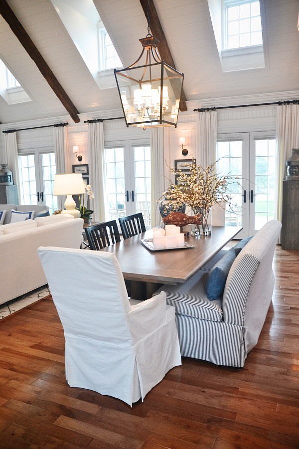 Gorgeous neutral dining room with high ceilings, lots of windows & doors, & the pops of blue Gorgeous neutral dining room with high ceilings, lots of windows & doors, & the pops of blue