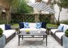16 Modern Garden dan Patio Furniture Decoration Ideas 2021 Gray Wicker Outdoor Sofa with Black and White Striped Umbrella